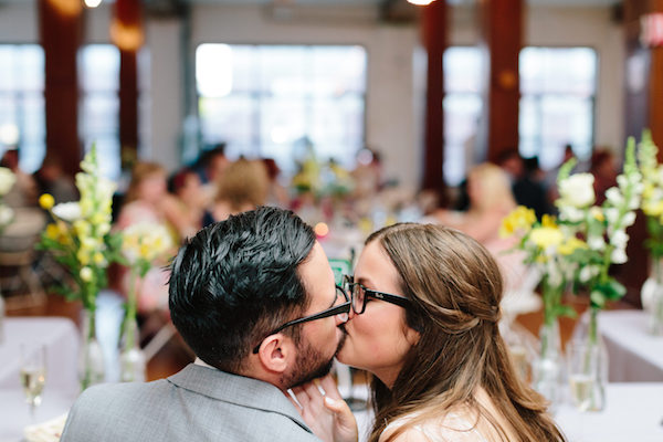 Bride and Groom Kiss at Wedding Reception