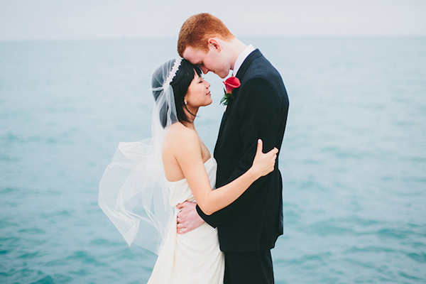 Bride and Groom Embrace in Front of Lake Michigan in Chicago