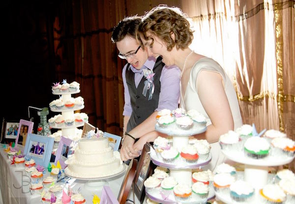 Newlyweds Cut Rainbow Cake and Cupcakes at Wedding