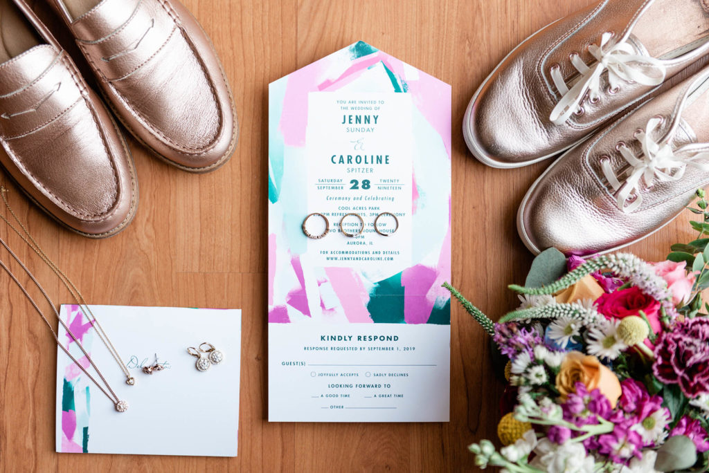 Rose Gold Wedding Keds next to Bright Color Wedding Flowers & Invitations