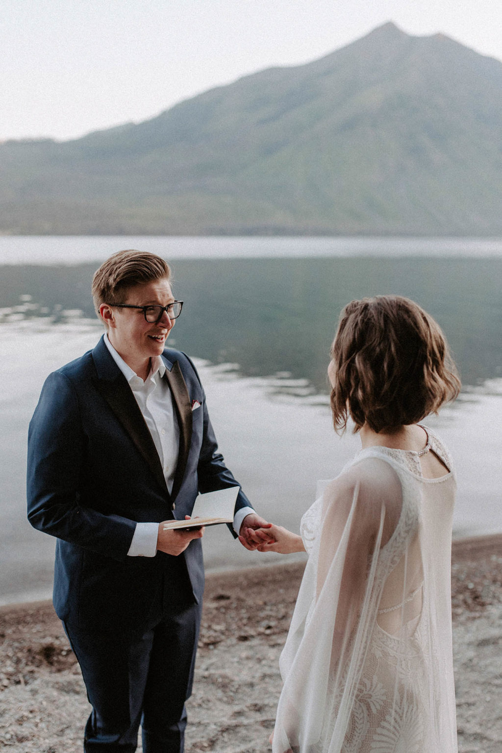 bride reads wedding vows to her partner