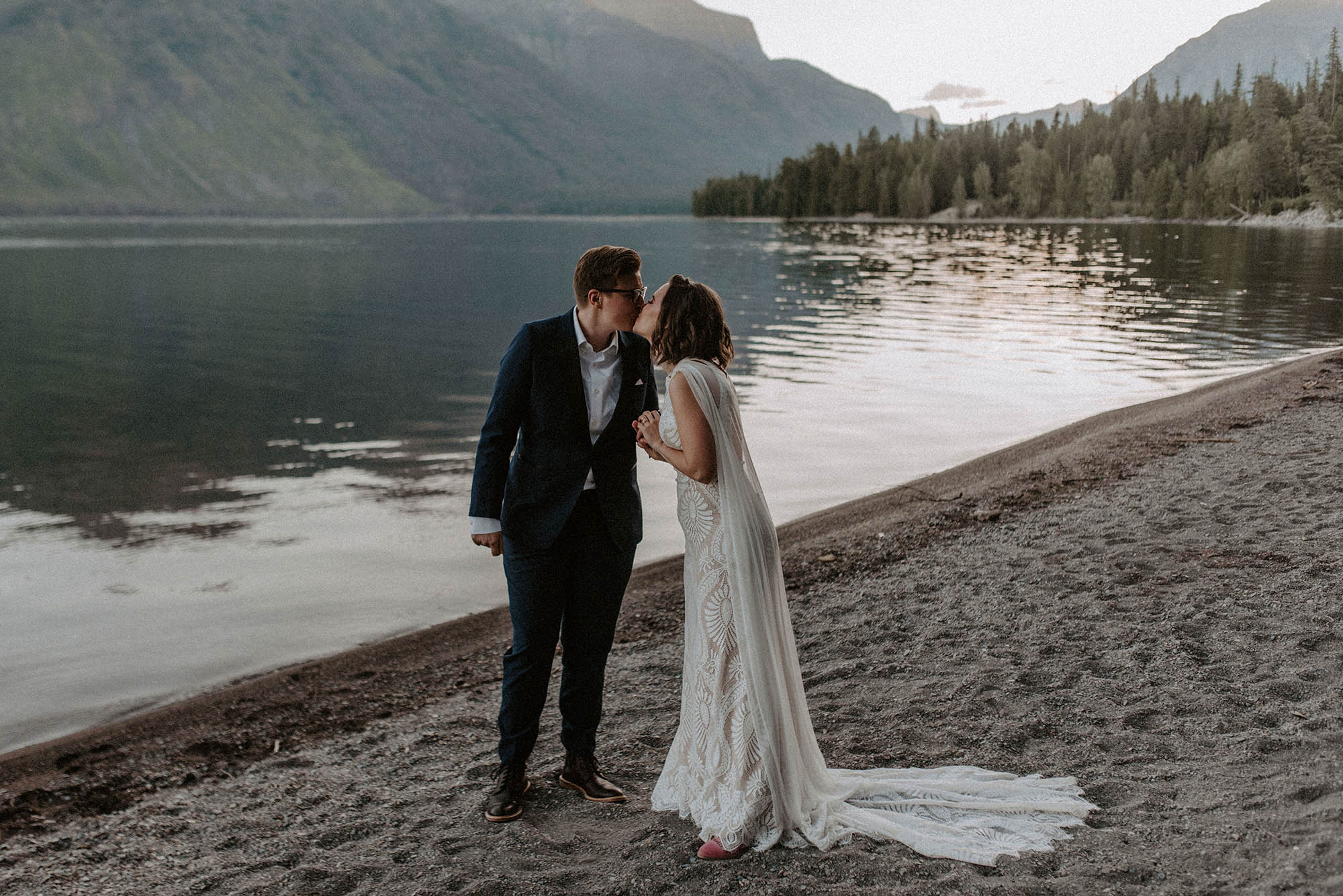 two brides kiss at Glacier National Park elopement