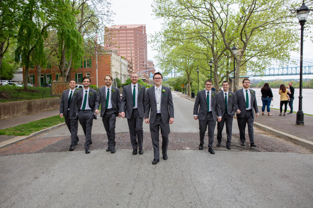 groom and groomsmen in gray suits with green ties in Cincinnati