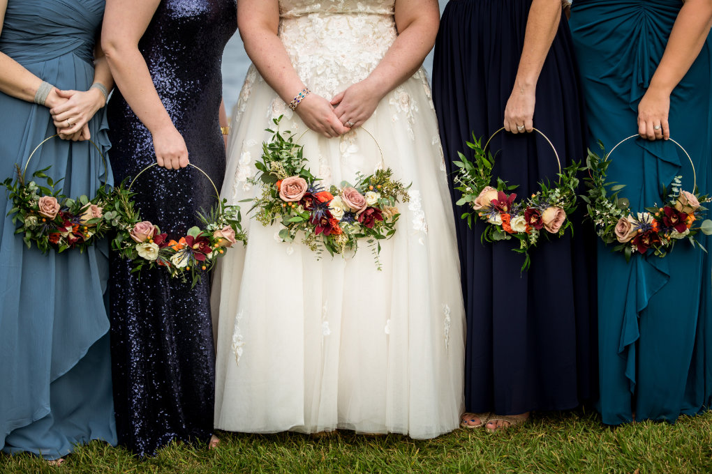 bride and bridesmaids with floral hoops