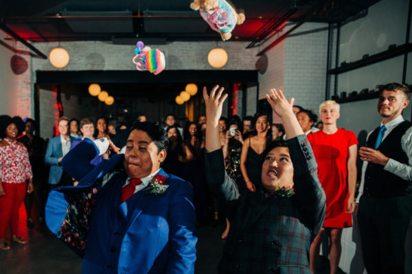 newlyweds toss stuffed animals into crowd