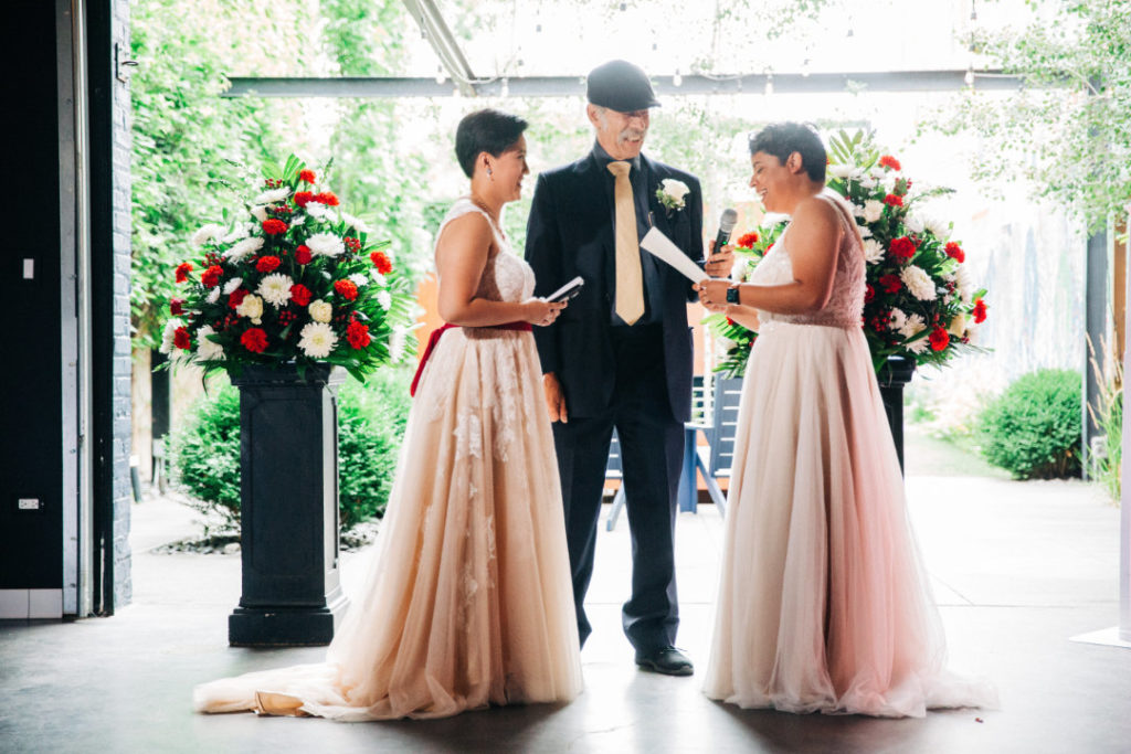 two brides exchange wedding vows