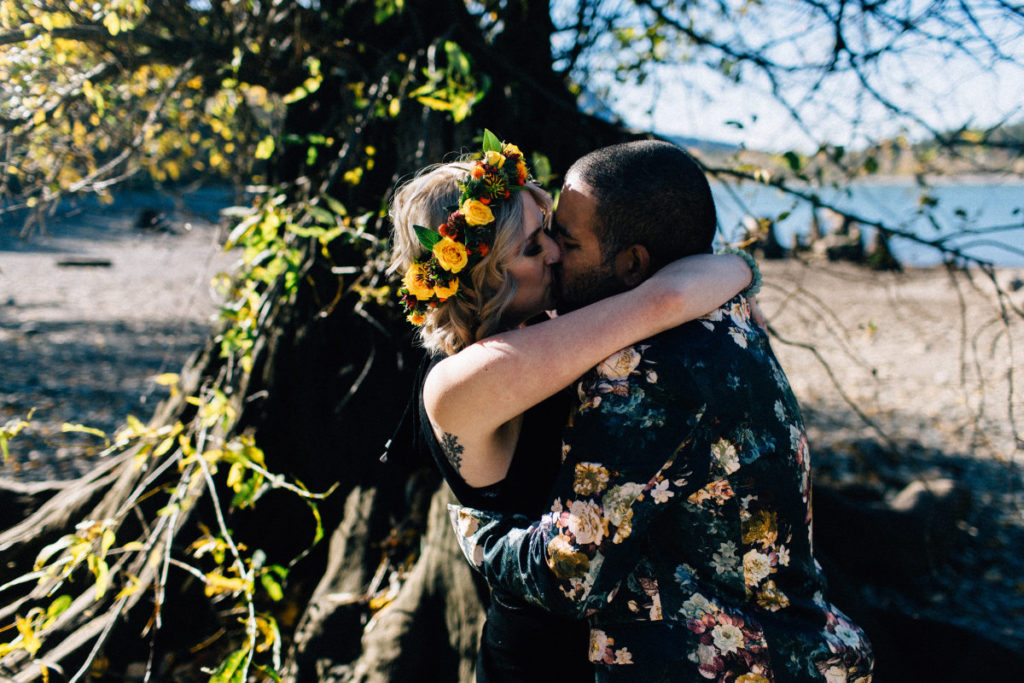 couple embrace and kiss at elopement ceremony
