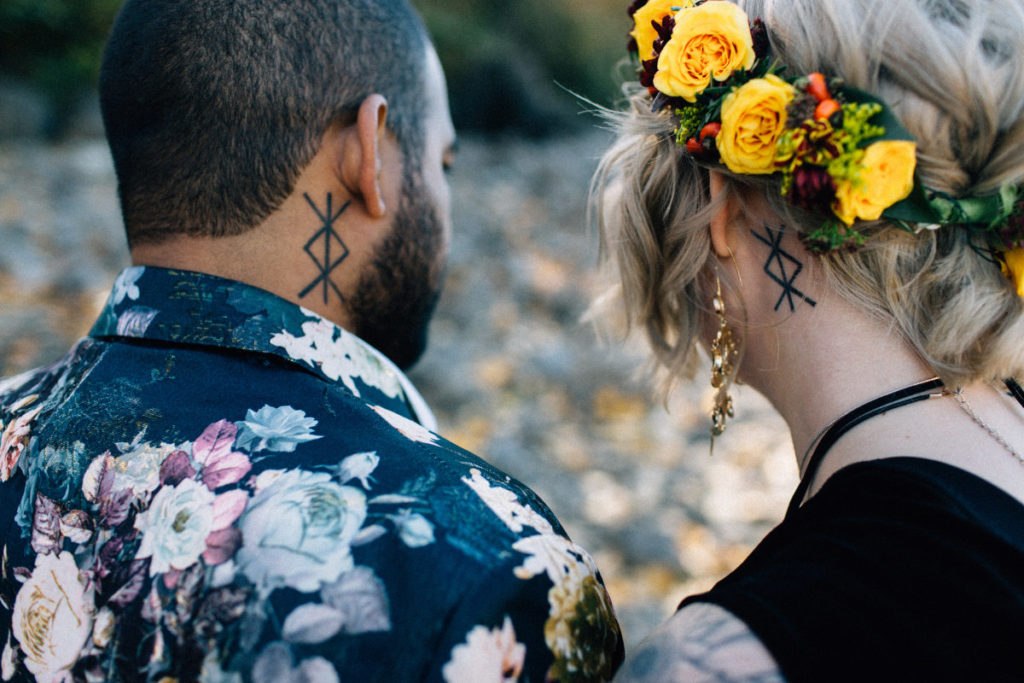 couple with matching neck tattoos