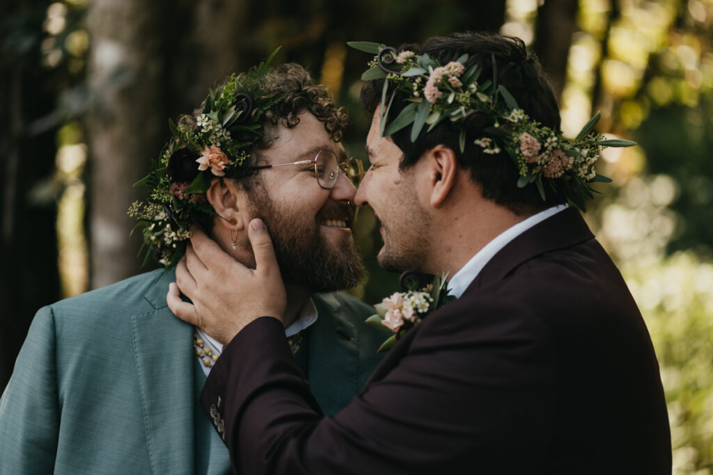 two grooms embrace at Trinity Tree Farm wedding