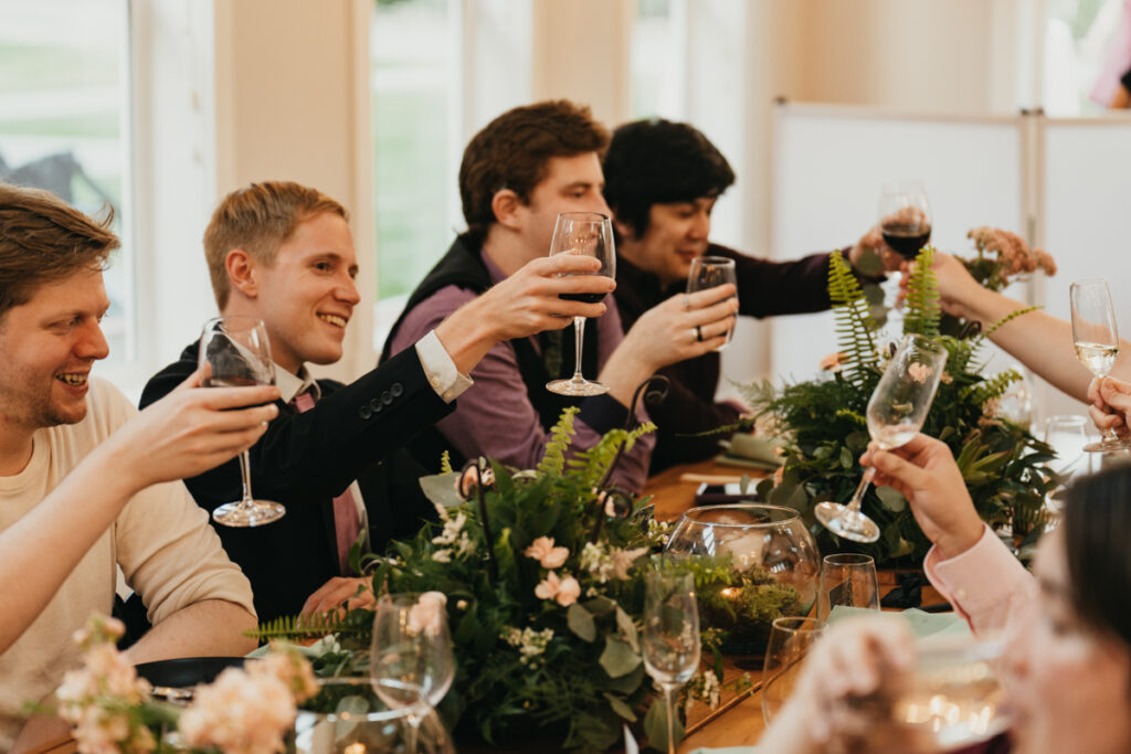 guests raise their classes for a toast at Trinity Tree Farm wedding