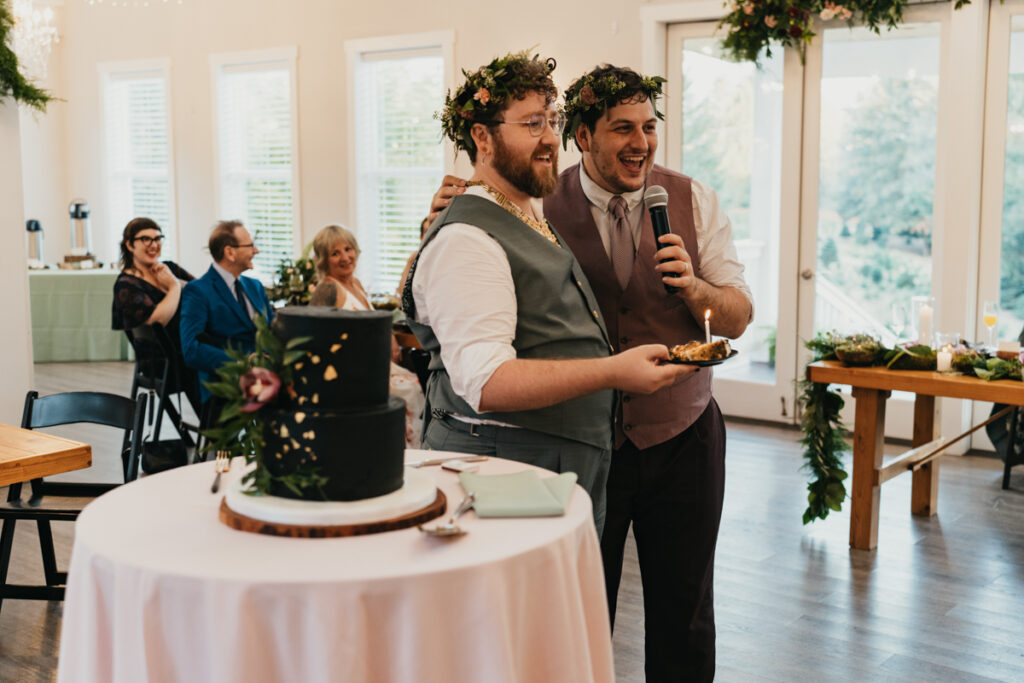 grooms standing next to wedding cake Trinity Tree Farm wedding