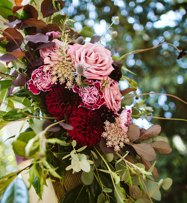 pink and maroon florals at wedding