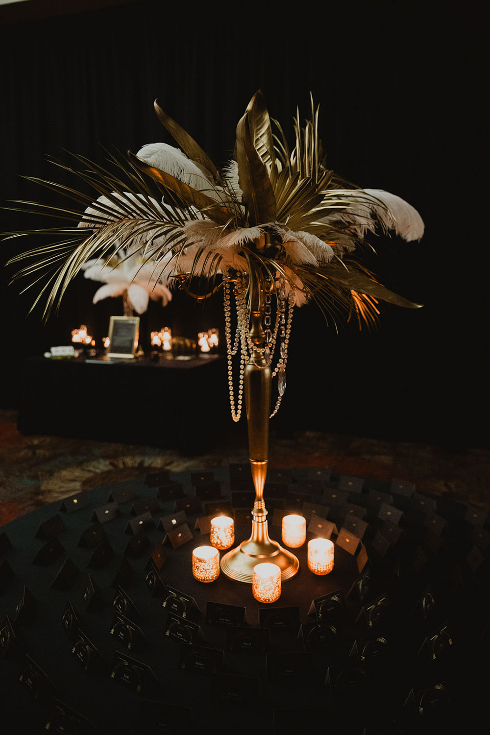 luxury centerpiece design with feathers and leaves