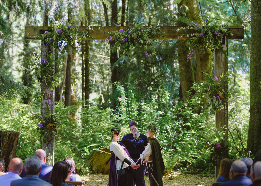wedding officiant in Seattle WA performing ceremony at a queer forest marriage