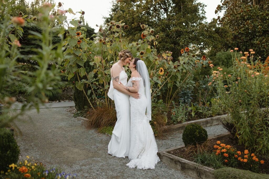 Newlyweds pose in the garden at Willows Lodge in Woodinville WA.