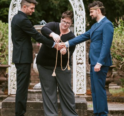 two grooms getting married at wedding ceremony in Seattle