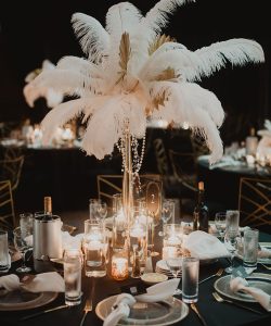 luxury feather and leaf centerpiece design with floating candles