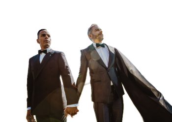Andy and Victor standing together on their wedding day